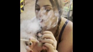 Sexy Smoker In Pigtails Eats Cum!