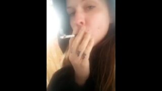 Stoner Beth Smoking A Marijuana Cigarette Outside